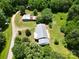 Aerial view of the property with multiple buildings, road access, and lush greenery at 140 Dalu Ln, Harmony, NC 28634