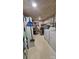 Unfinished basement includes laundry area and storage shelves at 140 Dalu Ln, Harmony, NC 28634