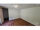 Bedroom featuring laminate floors, a ceiling light, and closet at 140 Dalu Ln, Harmony, NC 28634