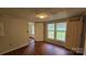 A bedroom that has laminate floors, light-colored walls, and natural lighting at 140 Dalu Ln, Harmony, NC 28634
