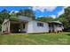 Single story home with white siding, metal roof, covered entry, and well maintained lawn at 140 Dalu Ln, Harmony, NC 28634