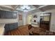 Cozy kitchen with stainless steel refrigerator, gray cabinets and outside access offers modern functionality at 140 Dalu Ln, Harmony, NC 28634