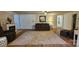 Cozy living room with fireplace, plush carpet, and comfortable seating at 140 Dalu Ln, Harmony, NC 28634