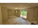 Room with light-colored walls, ceiling light, a door, and sliding glass door at 140 Dalu Ln, Harmony, NC 28634
