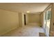 Open room with light colored walls, ceiling light, and a sliding glass door to the outside at 140 Dalu Ln, Harmony, NC 28634