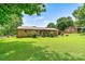 Spacious backyard featuring a well-maintained lawn and a covered back porch, perfect for outdoor gatherings at 141 Porter Rd, Statesville, NC 28625