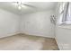 Bedroom featuring a carpeted floor, ceiling fan, and a window at 141 Porter Rd, Statesville, NC 28625