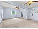 Bright bedroom featuring carpet, ceiling fan, and natural light at 141 Porter Rd, Statesville, NC 28625
