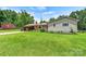 Lovely single-story home boasting a lush green lawn and charming exterior details at 141 Porter Rd, Statesville, NC 28625