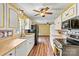 Updated kitchen featuring white cabinets, countertops and opens to another living area at 141 Porter Rd, Statesville, NC 28625