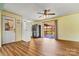 Bright kitchen with wood flooring, a stainless steel refrigerator, and an opening to the back deck at 141 Porter Rd, Statesville, NC 28625