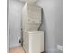 Compact laundry room with stacked washer and dryer at 141 Porter Rd, Statesville, NC 28625