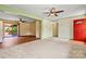 Open living area with a ceiling fan, connecting seamlessly to the dining space at 141 Porter Rd, Statesville, NC 28625