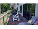 Relaxing back deck area with outdoor seating, lounge chair, and view at 1543 Withers Dr, Denver, NC 28037