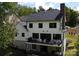 Multi-level deck offers ample space for relaxation and entertainment, overlooking the serene backyard at 1543 Withers Dr, Denver, NC 28037