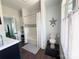 Bathroom featuring a tub with shower, decorative star, and white fixtures at 1543 Withers Dr, Denver, NC 28037