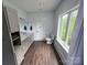 Bright bathroom with a large window offering scenic views, a sleek vanity, and a toilet at 1543 Withers Dr, Denver, NC 28037