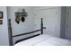 Bedroom featuring a four-poster bed, closet, and decorative hats on the wall at 1543 Withers Dr, Denver, NC 28037