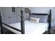 Charming bedroom with a decorative pillow, four-poster bed, and white walls at 1543 Withers Dr, Denver, NC 28037