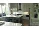 Stylish kitchen with gray cabinets, a kitchen island, and stainless steel appliances, perfect for cooking at 1543 Withers Dr, Denver, NC 28037