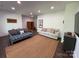 Bright living room features wood-look flooring, neutral walls, and comfortable seating at 1543 Withers Dr, Denver, NC 28037