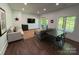 Inviting living area with natural light, wood-look floors, and an adjacent outdoor patio at 1543 Withers Dr, Denver, NC 28037