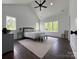 Spacious main bedroom with high ceilings, lots of natural light and wood flooring at 1543 Withers Dr, Denver, NC 28037