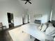 Bright main bedroom featuring high ceilings, neutral décor, and connecting ensuite bathroom at 1543 Withers Dr, Denver, NC 28037