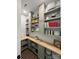 Spacious walk-in pantry with custom cabinets, countertops and open shelving at 1543 Withers Dr, Denver, NC 28037