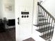 Staircase featuring white risers and stained treads, adding a welcoming feature to the home at 1543 Withers Dr, Denver, NC 28037