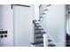 Modern staircase with stained treads and black metal railings, blending functionality with style at 1543 Withers Dr, Denver, NC 28037