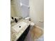 Bathroom featuring a vanity with granite countertops, a toilet, and tile floors at 1624 Arlyn Cir # G, Charlotte, NC 28213