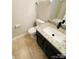 Bathroom with a granite countertop vanity and modern fixtures at 1624 Arlyn Cir # G, Charlotte, NC 28213