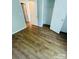 Bedroom featuring wood-look flooring and a closet at 1624 Arlyn Cir # G, Charlotte, NC 28213