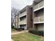 Brick apartment building with multiple floors, balconies, and well-maintained landscaping at 1624 Arlyn Cir # G, Charlotte, NC 28213
