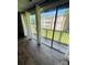 Bright living room with sliding glass doors to the deck with view of the yard at 1624 Arlyn Cir # G, Charlotte, NC 28213