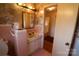 Retro bathroom featuring pink tile, a classic vanity, and traditional fixtures in a vintage design at 170 Heritage Ln, Salisbury, NC 28147