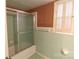 Bathroom showcasing a shower and tiled walls with pink accents at 170 Heritage Ln, Salisbury, NC 28147