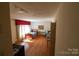 Inviting room with hardwood floors, large bright windows, and neutral walls, ready for your personal touch at 170 Heritage Ln, Salisbury, NC 28147