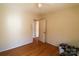 Simple bedroom with hardwood floors and a view of the hallway at 170 Heritage Ln, Salisbury, NC 28147