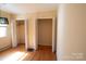 Bedroom view showcasing hardwood floors and open closet space at 170 Heritage Ln, Salisbury, NC 28147