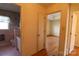 Hallway view leading to a bedroom and a tiled bathroom with pink accents at 170 Heritage Ln, Salisbury, NC 28147