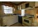 Functional kitchen featuring vintage appliances, dual basin sink, and ample cabinet space at 170 Heritage Ln, Salisbury, NC 28147