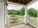 Balcony view of lush greenery, fence and trees at 17119 Doe Valley Ct, Cornelius, NC 28031