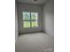 Bedroom with view of a manicured lawn and white fence at 17119 Doe Valley Ct, Cornelius, NC 28031