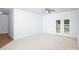 Bright room with carpet, ceiling fan and double doors to balcony at 17119 Doe Valley Ct, Cornelius, NC 28031