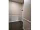 Hallway in need of some TLC, with carpeting, a numbered door and base trim at 17119 Doe Valley Ct, Cornelius, NC 28031