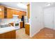Bright kitchen showcasing wood cabinets, stainless steel refrigerator, and lots of counter space at 17119 Doe Valley Ct, Cornelius, NC 28031