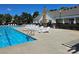 Community pool with lounge chairs and a clear blue swimming pool at 17119 Doe Valley Ct, Cornelius, NC 28031