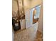 Utility area featuring tile flooring, a water heater, and HVAC system at 17119 Doe Valley Ct, Cornelius, NC 28031